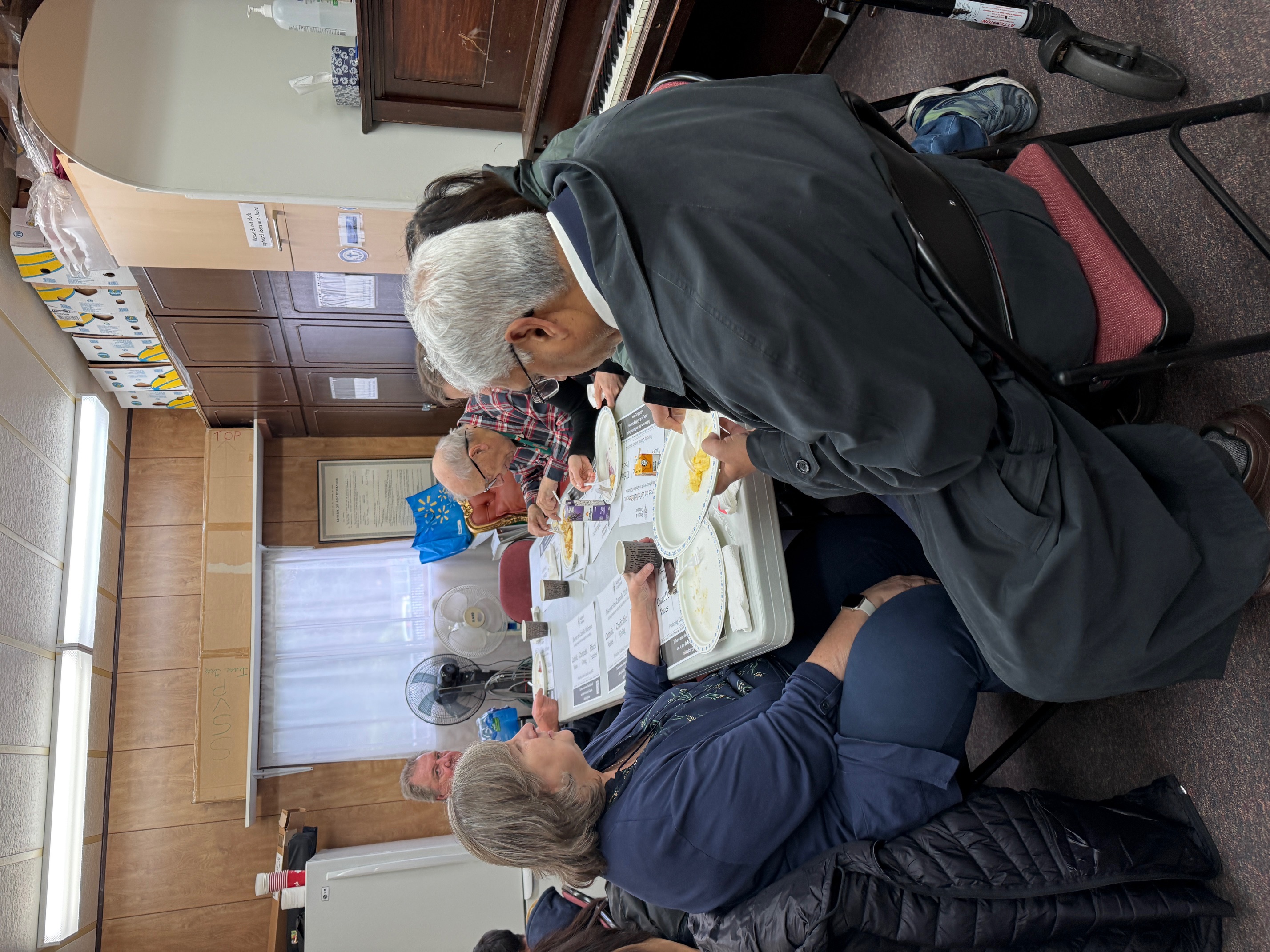 Another table of parishioners sharing breakfast and conversation