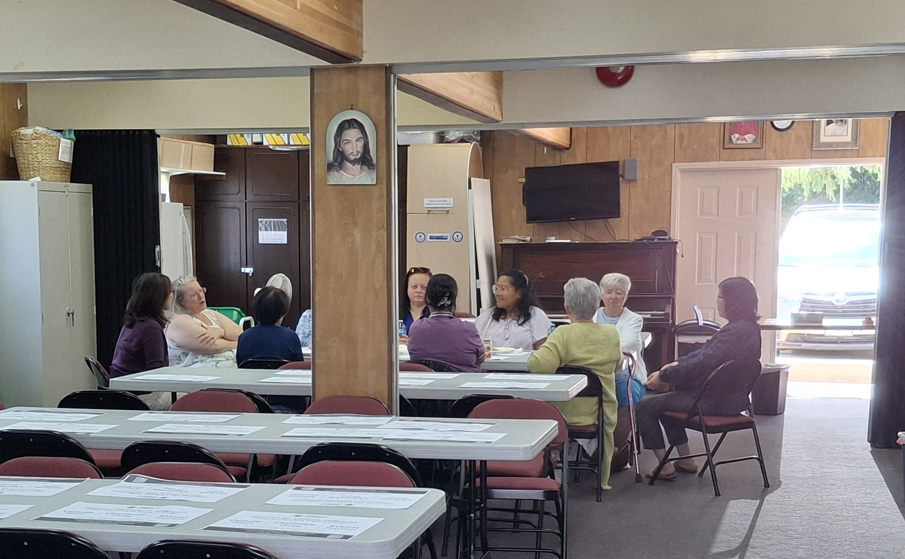 Another view of the portable with parishioners gathered
