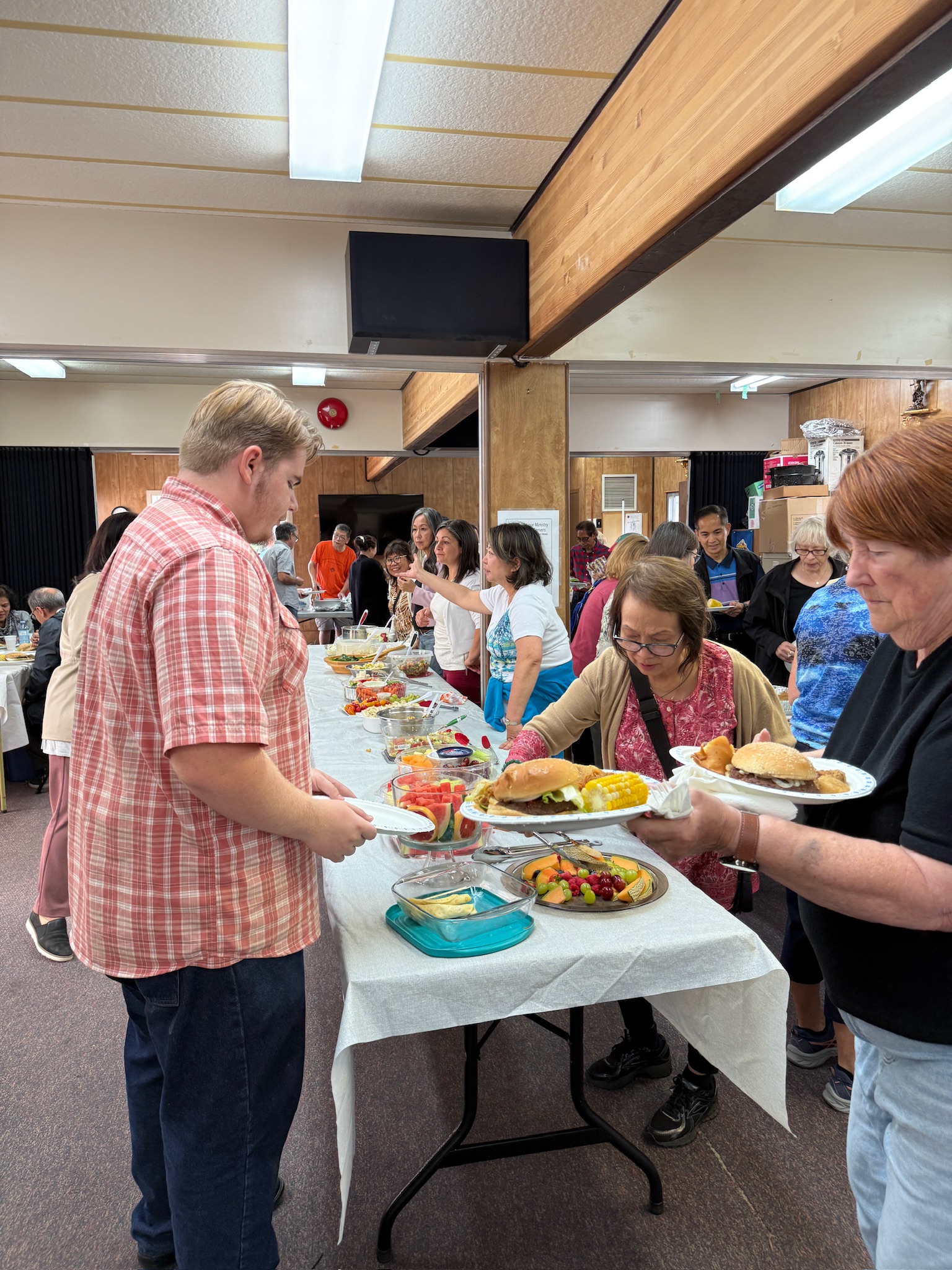 Buffet table filled with homemade dishes at the picnic