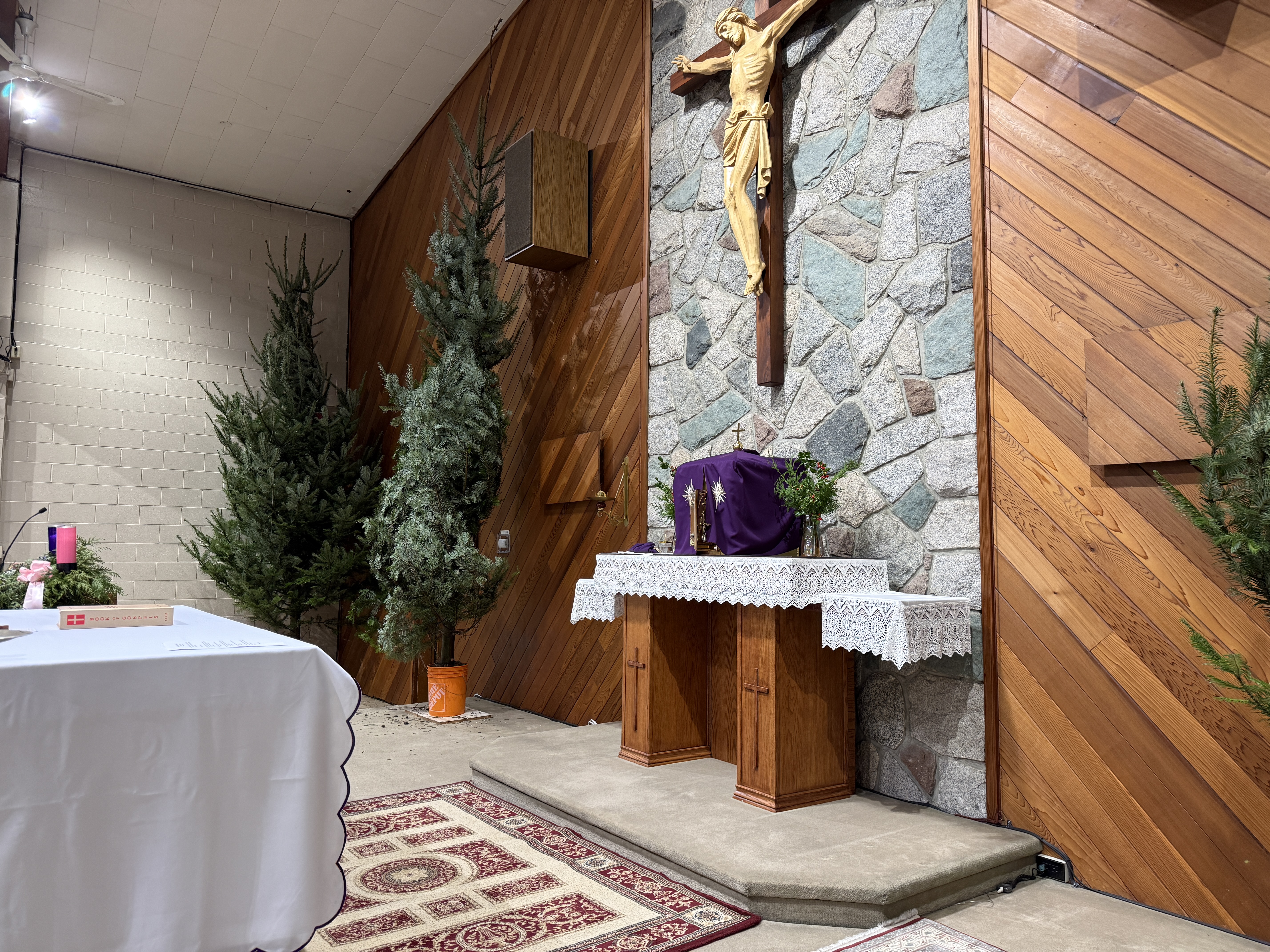 Rotating the tree so the best side faces the pews.