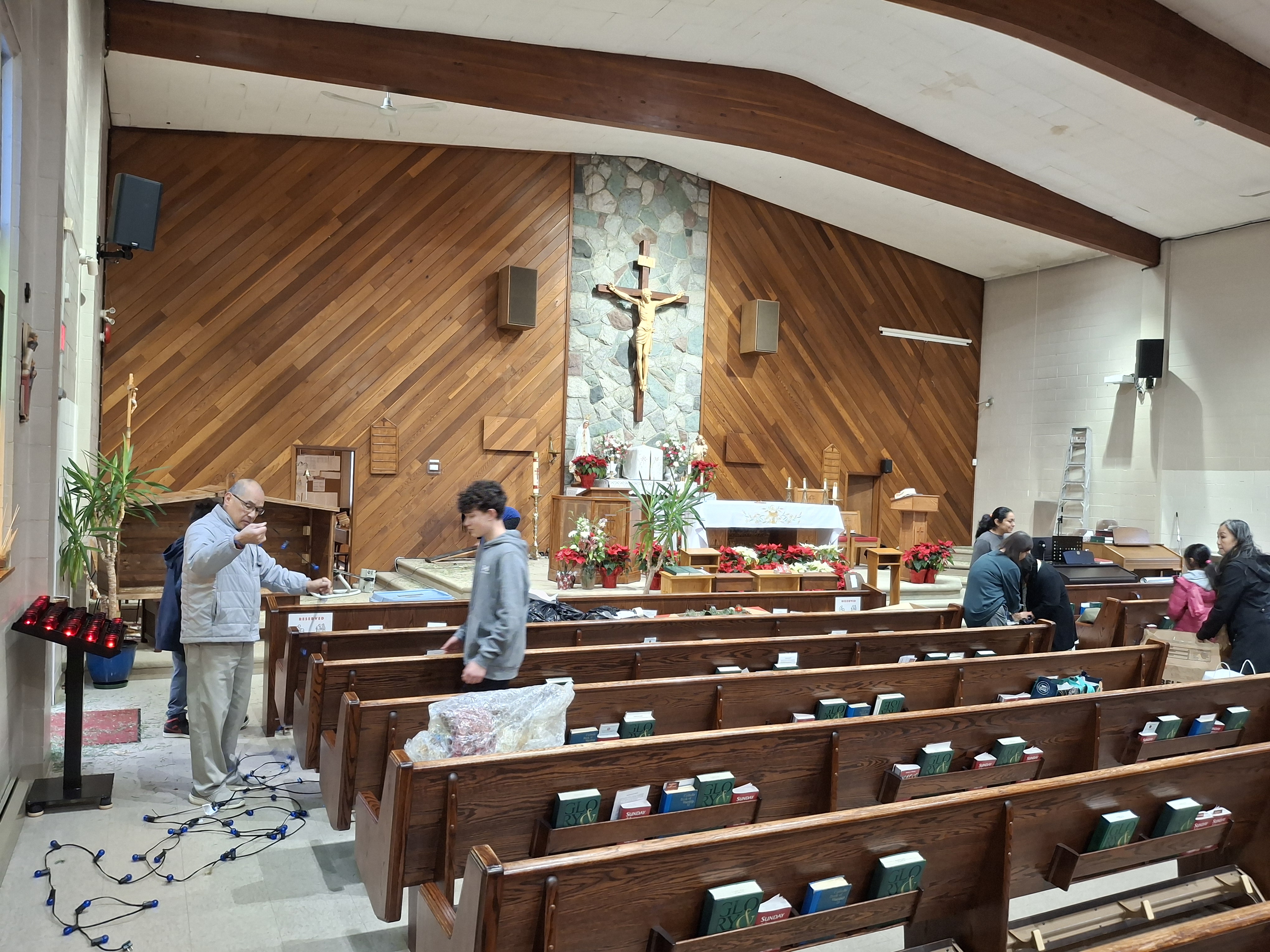 Volunteers removing decorations after Mass